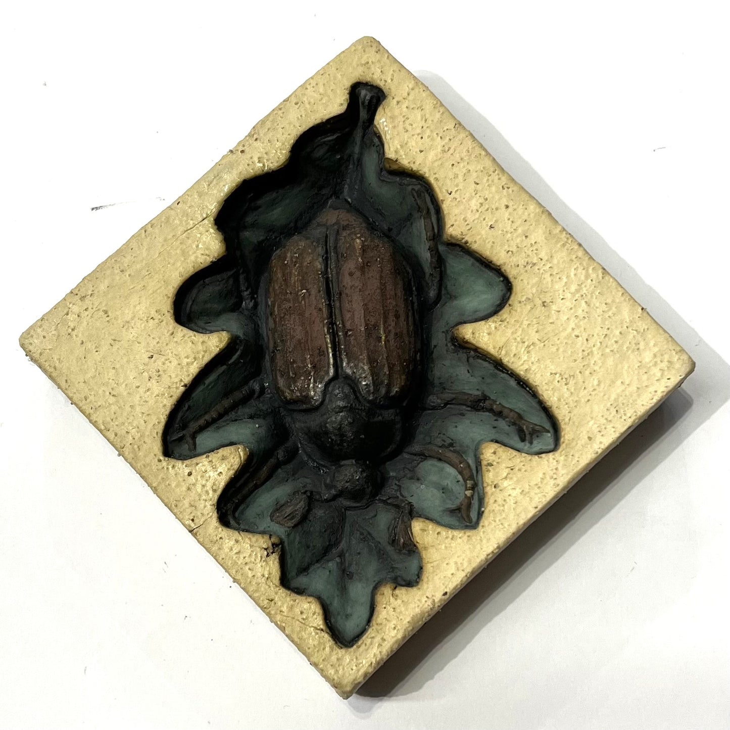 May Bug on Oak Leaf by Ama Menec ceramic sculpture