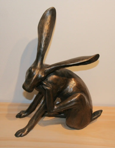 Bronze Cast Sculpture of a Scratching Hare by Joanna Martins