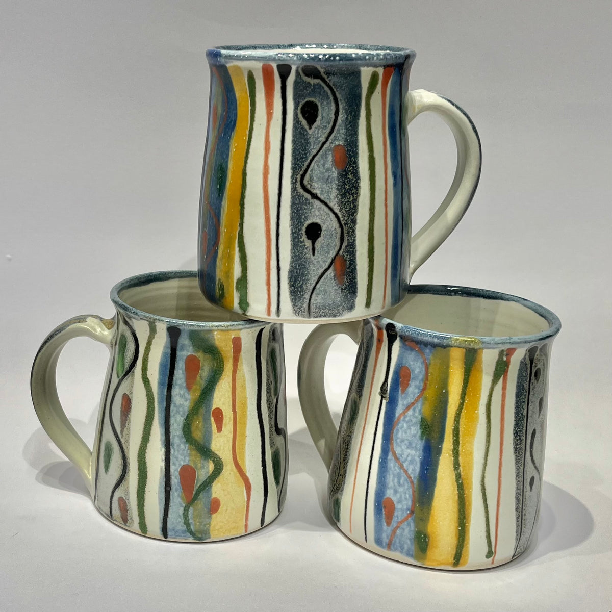 ceramic mugs with abstract hand-painted design made by lea Phillips