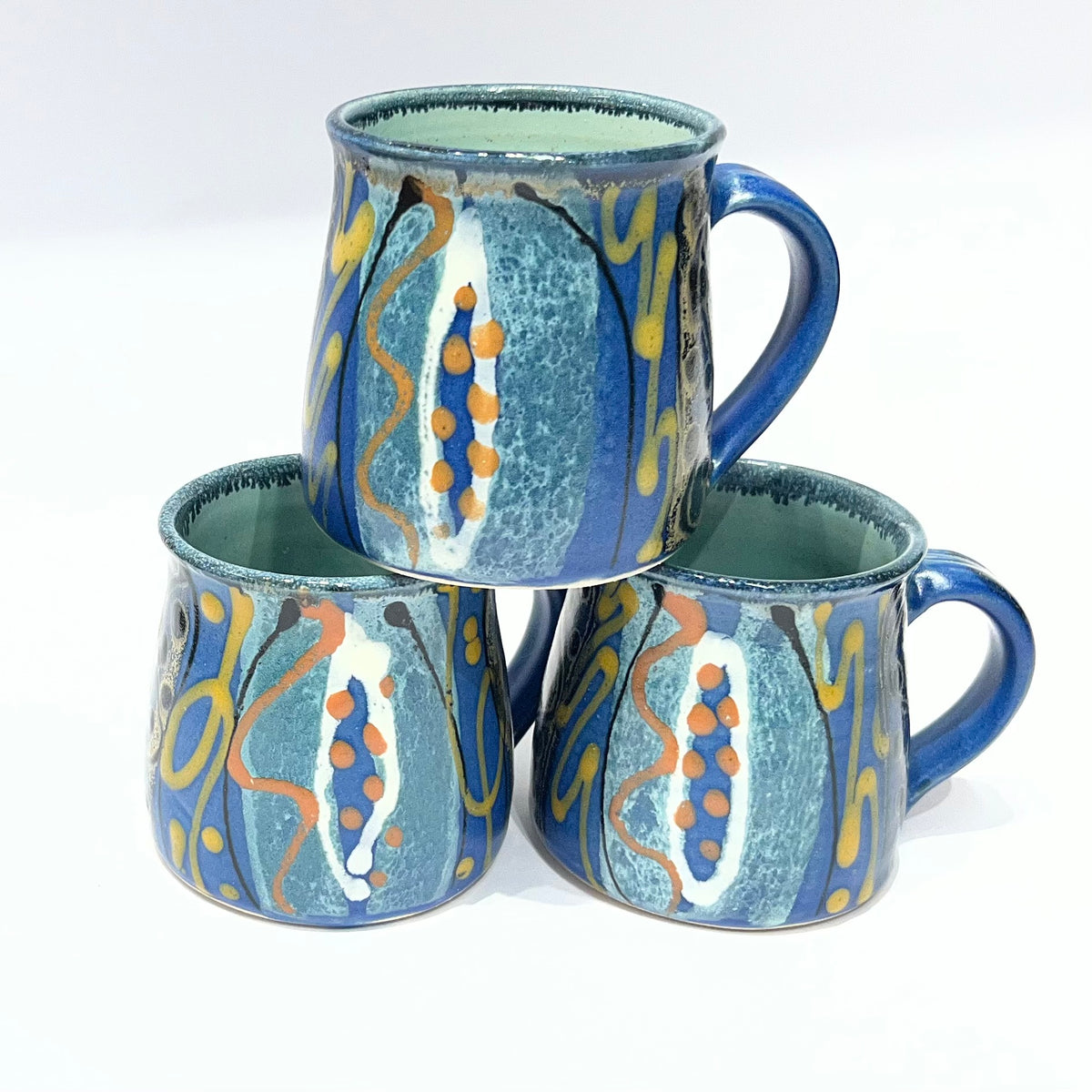 featuring a blue and teal abstract pattern with orange and gold accents by Lea Phillips